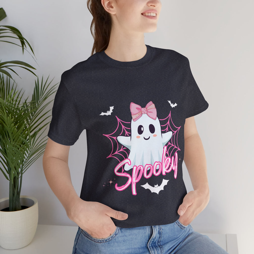 Person wearing a Heather navy t-shirt with a ghost design and 'Spooky' text, standing indoors.