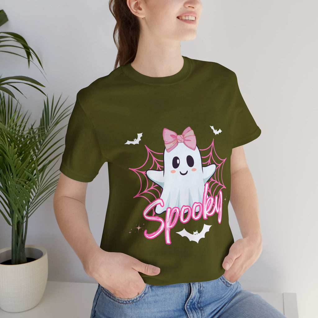 Person wearing a Olive t-shirt with a ghost design and 'Spooky' text, standing indoors.
