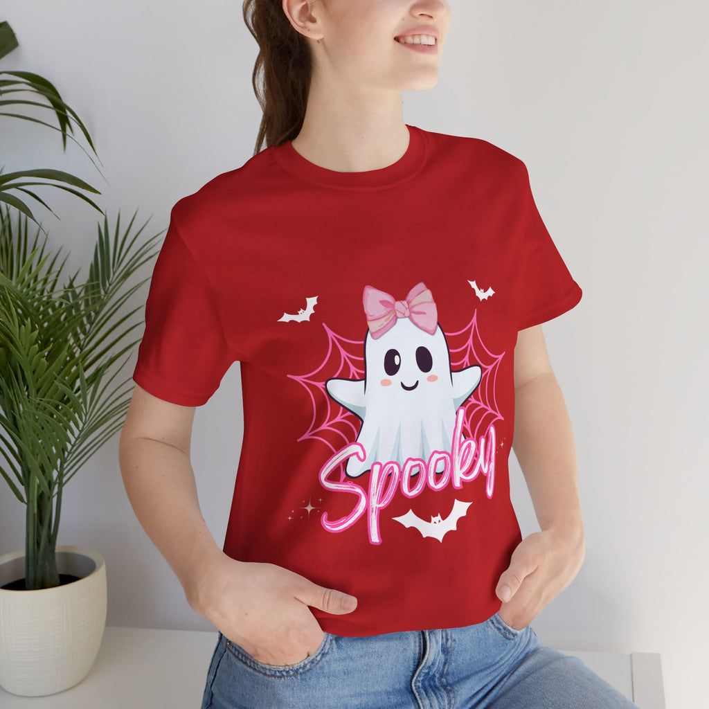 Person wearing a red t-shirt with a ghost design and 'Spooky' text, standing indoors.