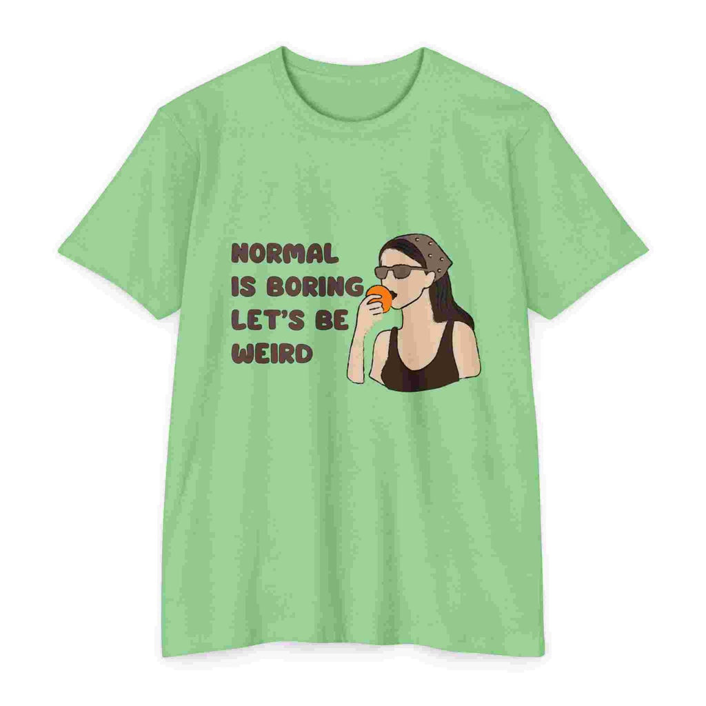 Apple Green t-shirt with a graphic of a woman drinking coffee and text 'Normal is boring, let's be weird' on a white background.