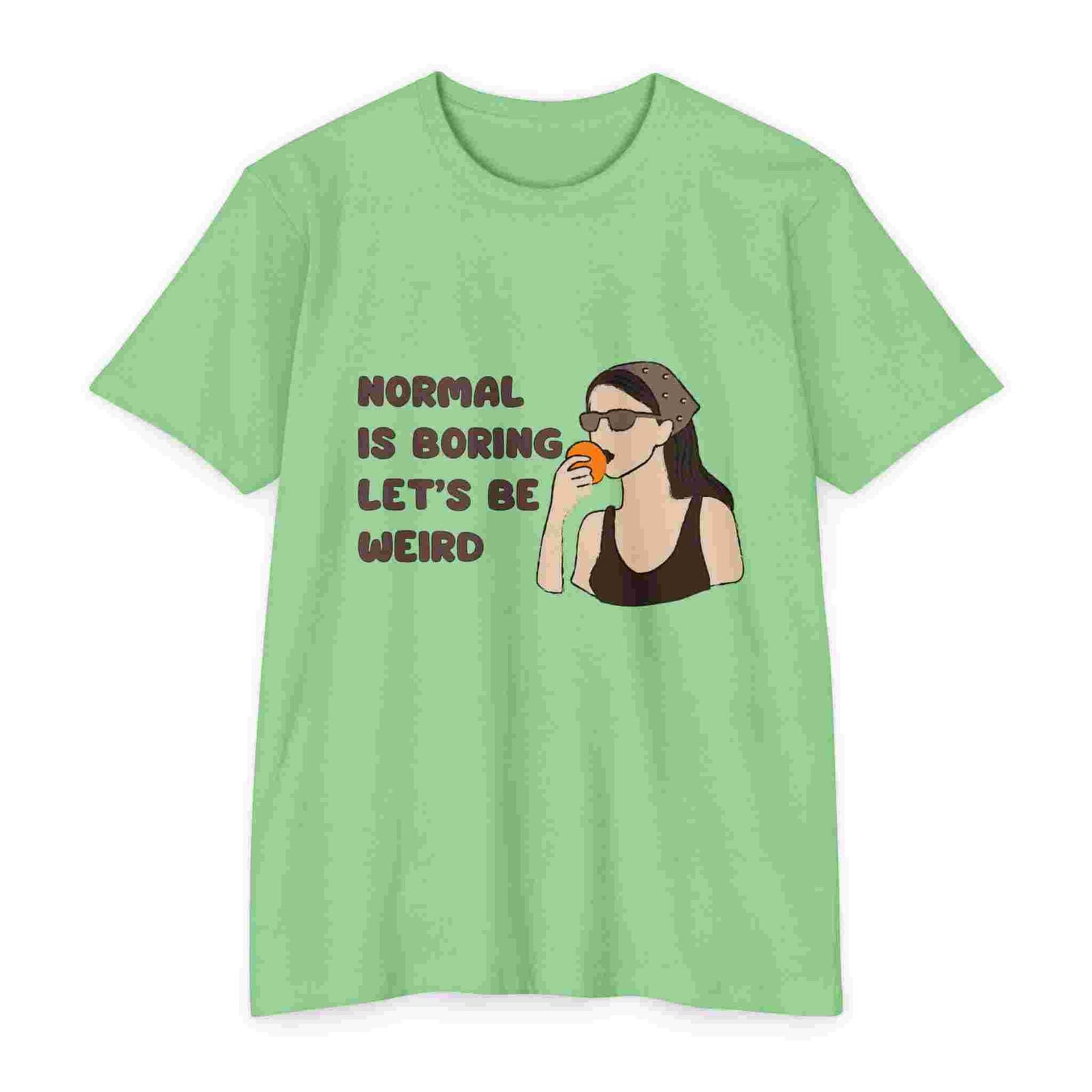Apple Green t-shirt with a graphic of a woman drinking coffee and text 'Normal is boring, let's be weird' on a white background.