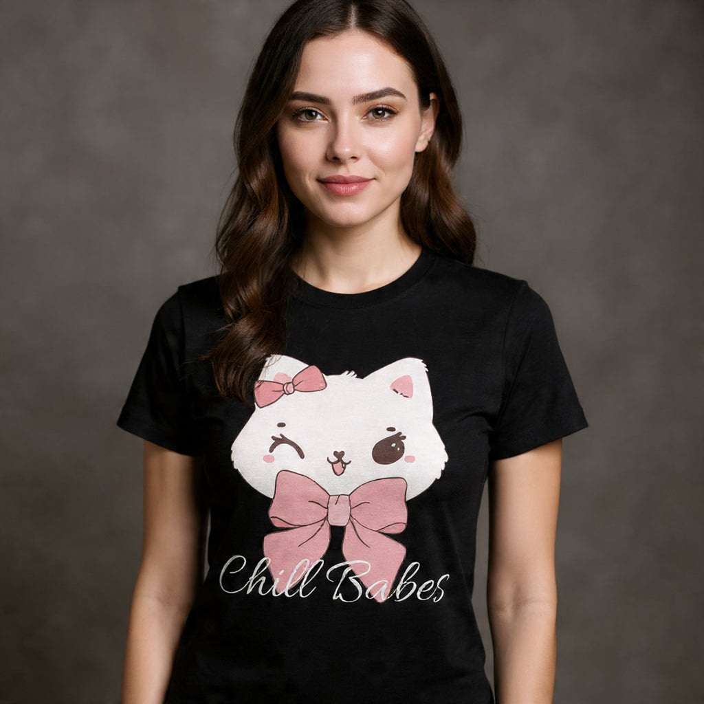 Woman wearing a black t-shirt with a cartoon cat design and text on a dark background