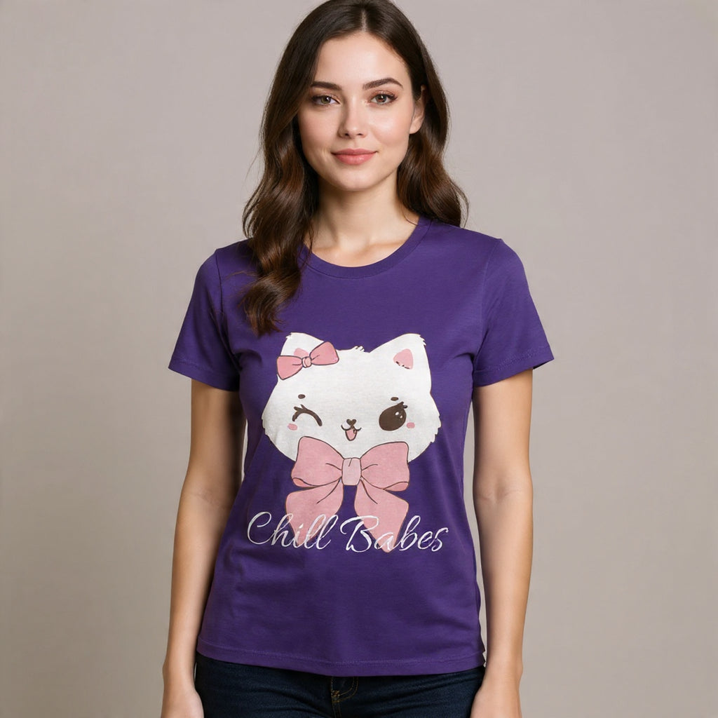 Woman wearing a True purple t-shirt with a cartoon cat design and text on a plain background