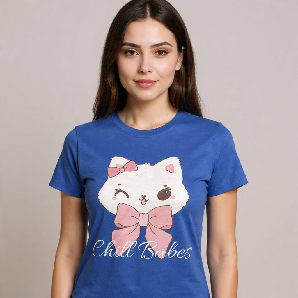 Woman wearing a True Royal t-shirt with a cartoon cat design and text on a beige background
