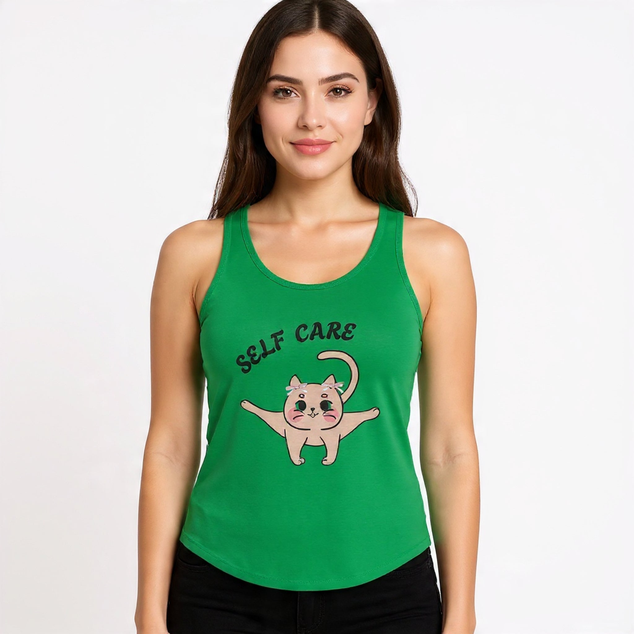 Woman wearing a Solid kelly green tank top with a cat illustration and 'Self Care' text on a white background