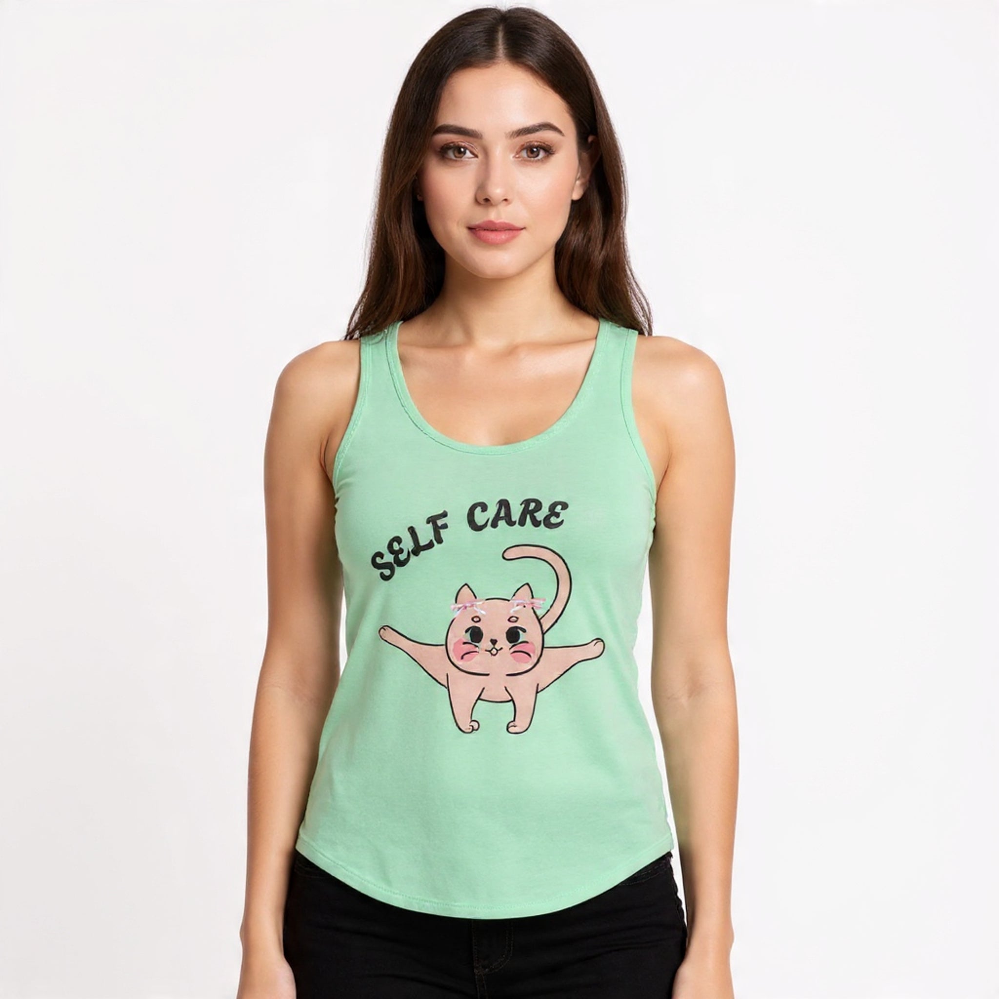 Woman wearing a Solid Mint tank top with a pink cat illustration and 'SELF CARE' text on a white background