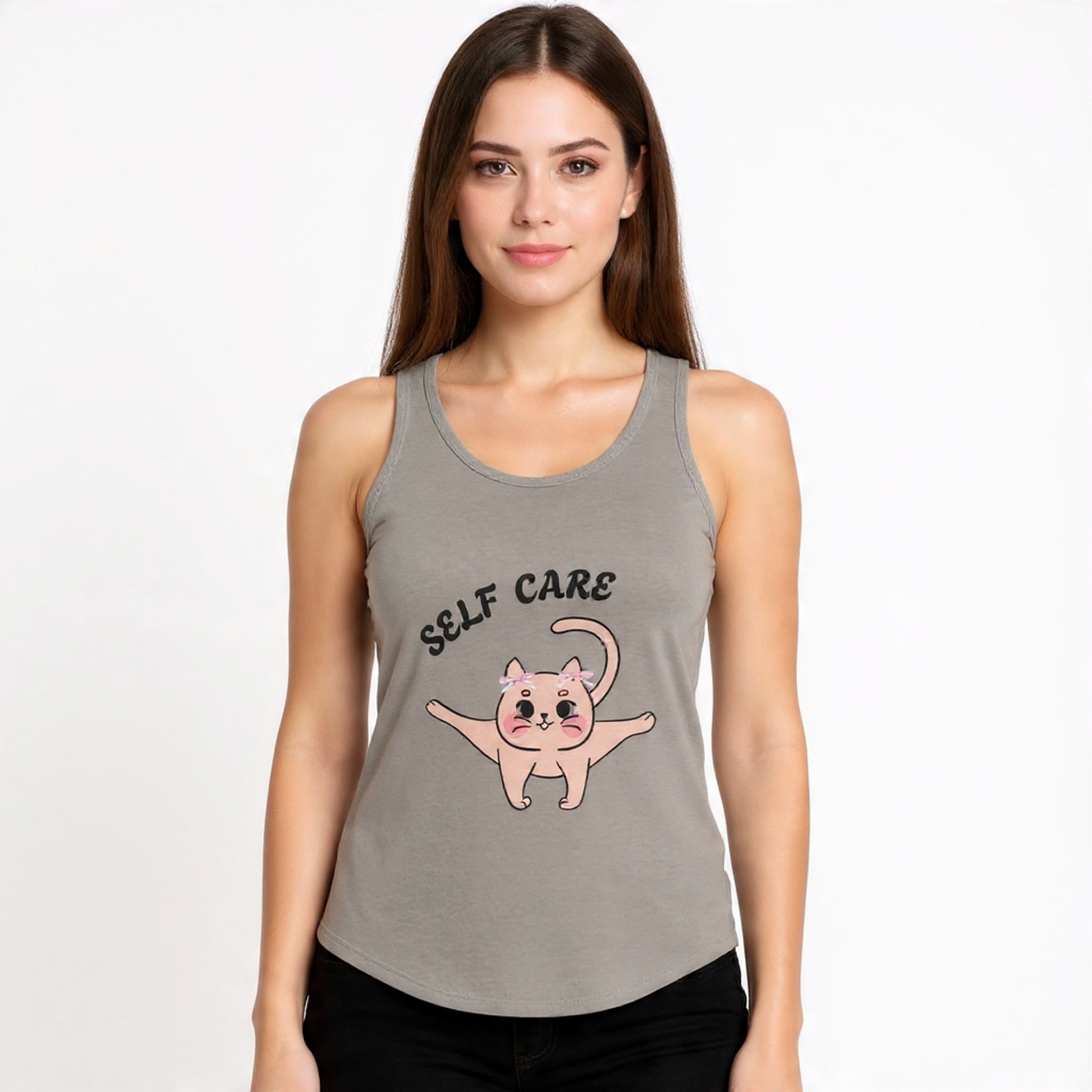 Woman wearing a Solid warm grey tank top with 'Self Care' and a cat illustration on a plain background