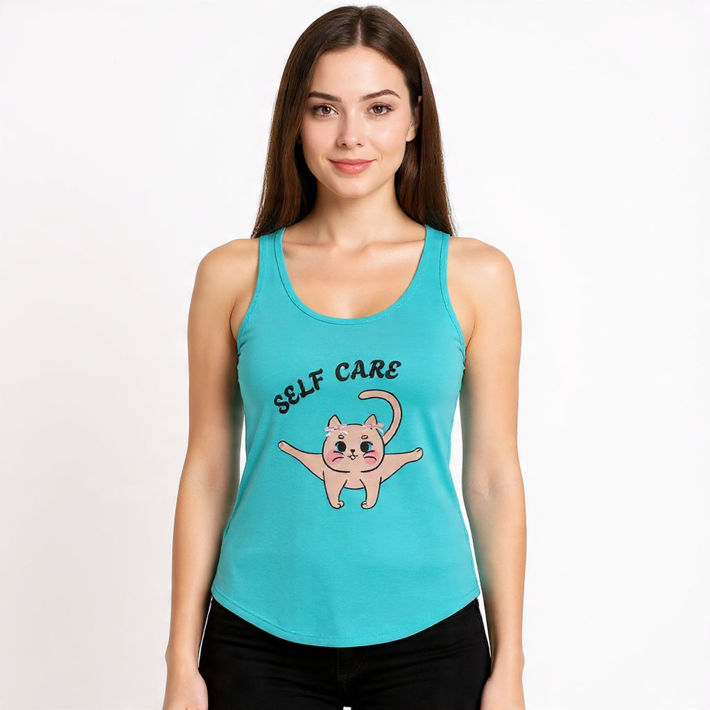 Woman wearing a Tahiti Blue tank top with a cat illustration and 'Self Care' text on a white background